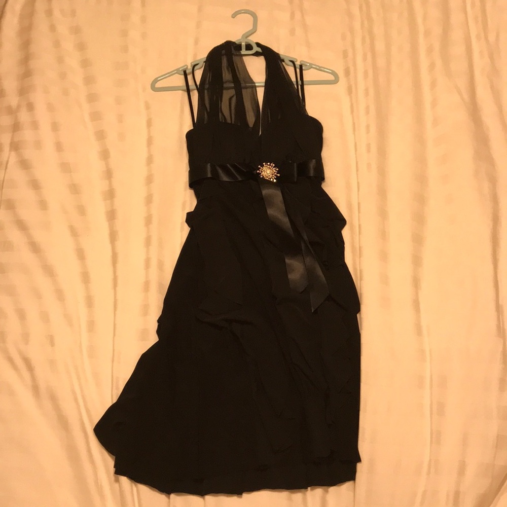 black midi dress with adorable broach in middle